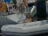 Sarah cleans the dinghy, 10/99